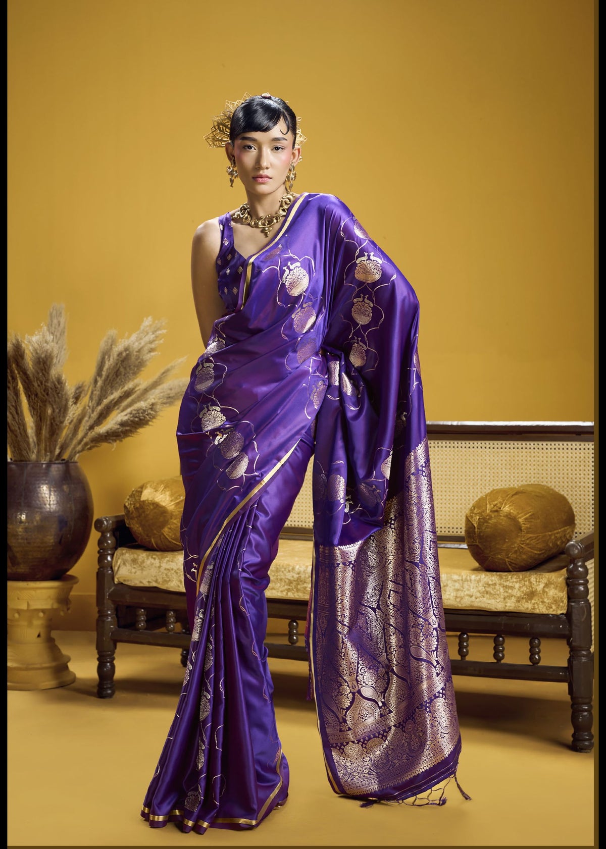 Purple silk saree with intricate gold embroidery and rich zari border