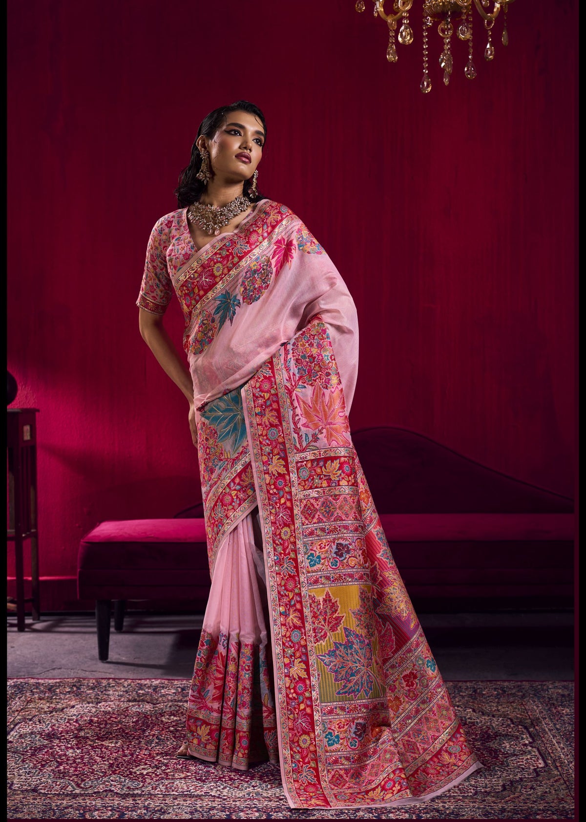 "Blush pink embroidered silk saree with vibrant floral threadwork and sequin detailing - premium ethnic wear for weddings"