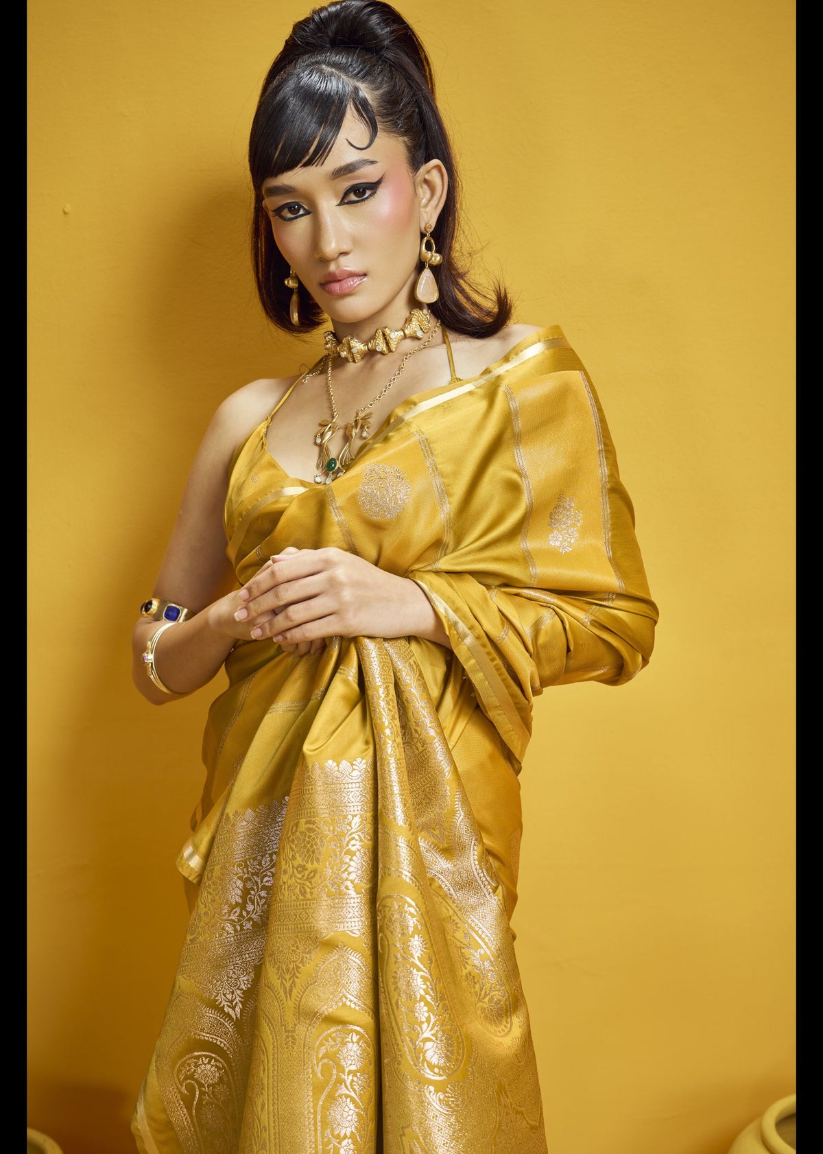 Golden tissue silk saree with silver zari panels and ornate paisley pallu. Luxurious Indian ethnic wear for weddings and celebrations. Bollywood4u Australia.