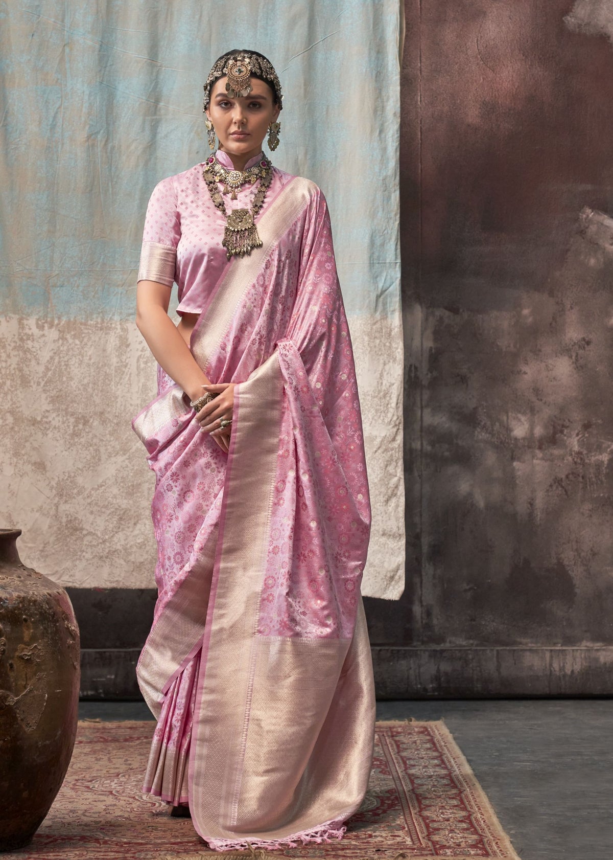 Silk saree with blended pink, gold, and cream floral weaving, paired with a dotted high‑neck blouse.