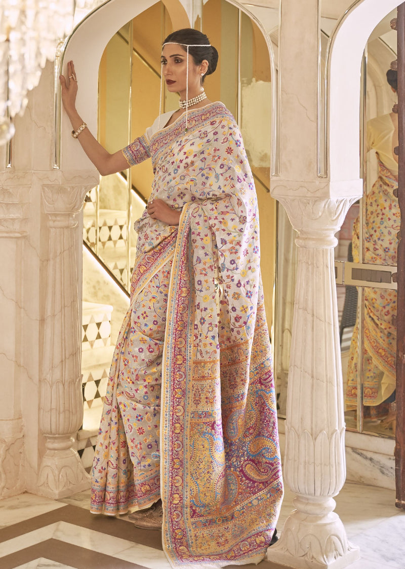 Pastel Kashmiri silk saree with vibrant floral motifs and ornate border, perfect for bridal receptions and traditional Indian fashion shoots.