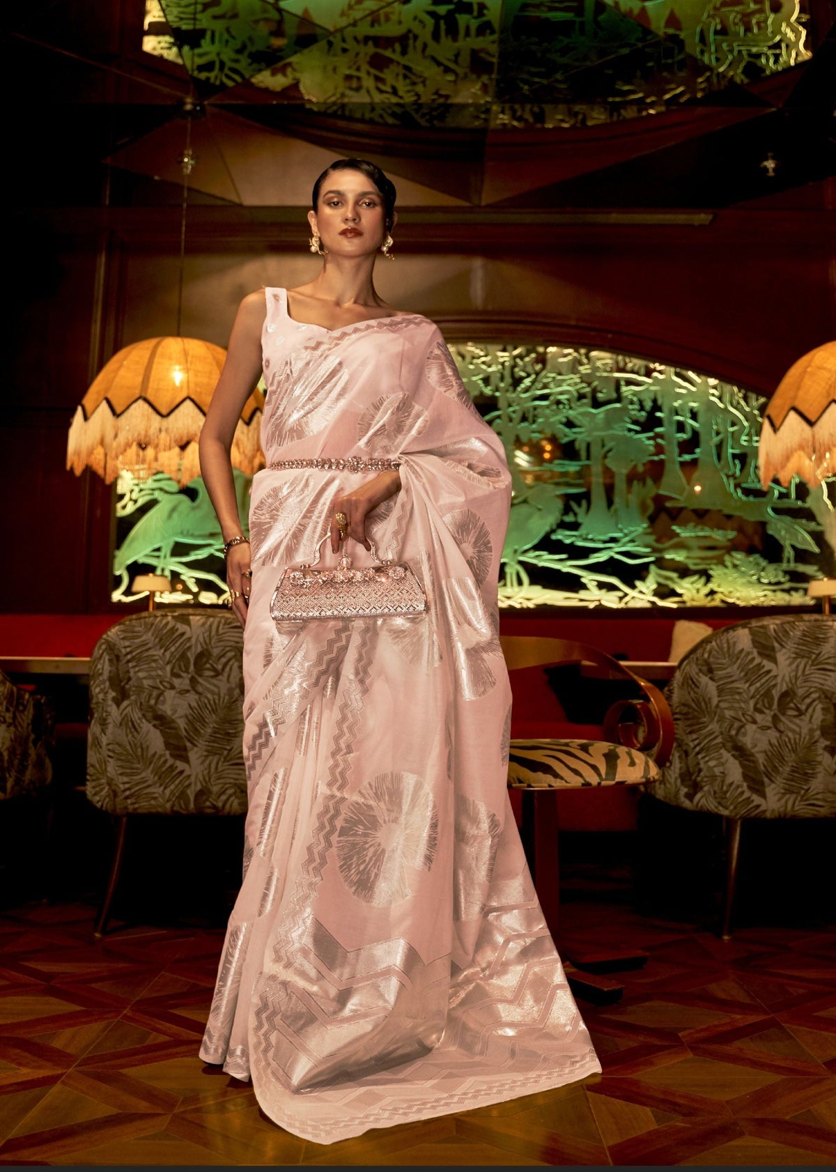 Soft pink baby pink silk saree with silver circular motifs and zigzag borders—festive shimmer for receptions and pujas