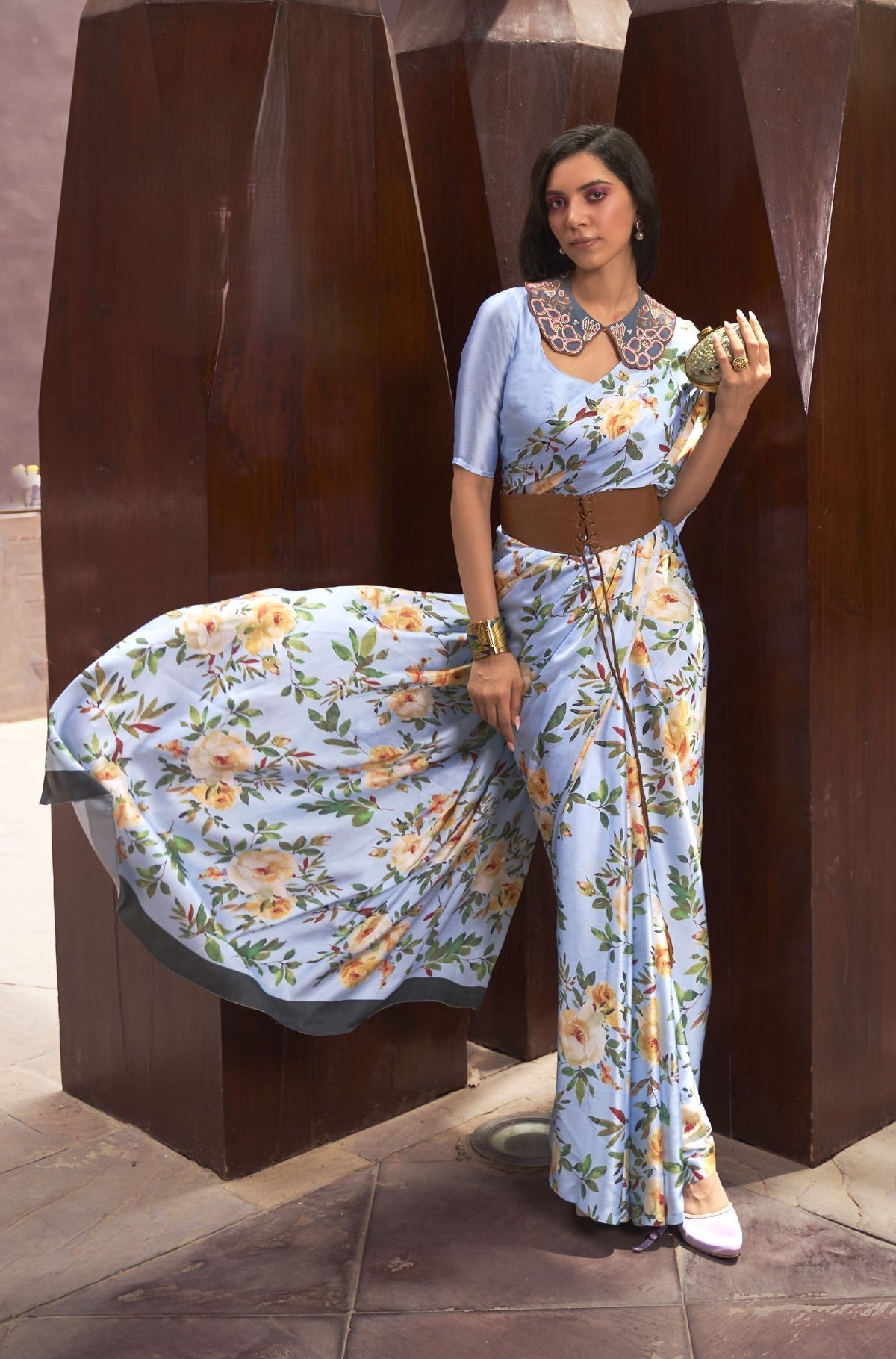 Light blue silk saree with yellow-white floral print—fresh pick for haldi, brunches, and festive mornings