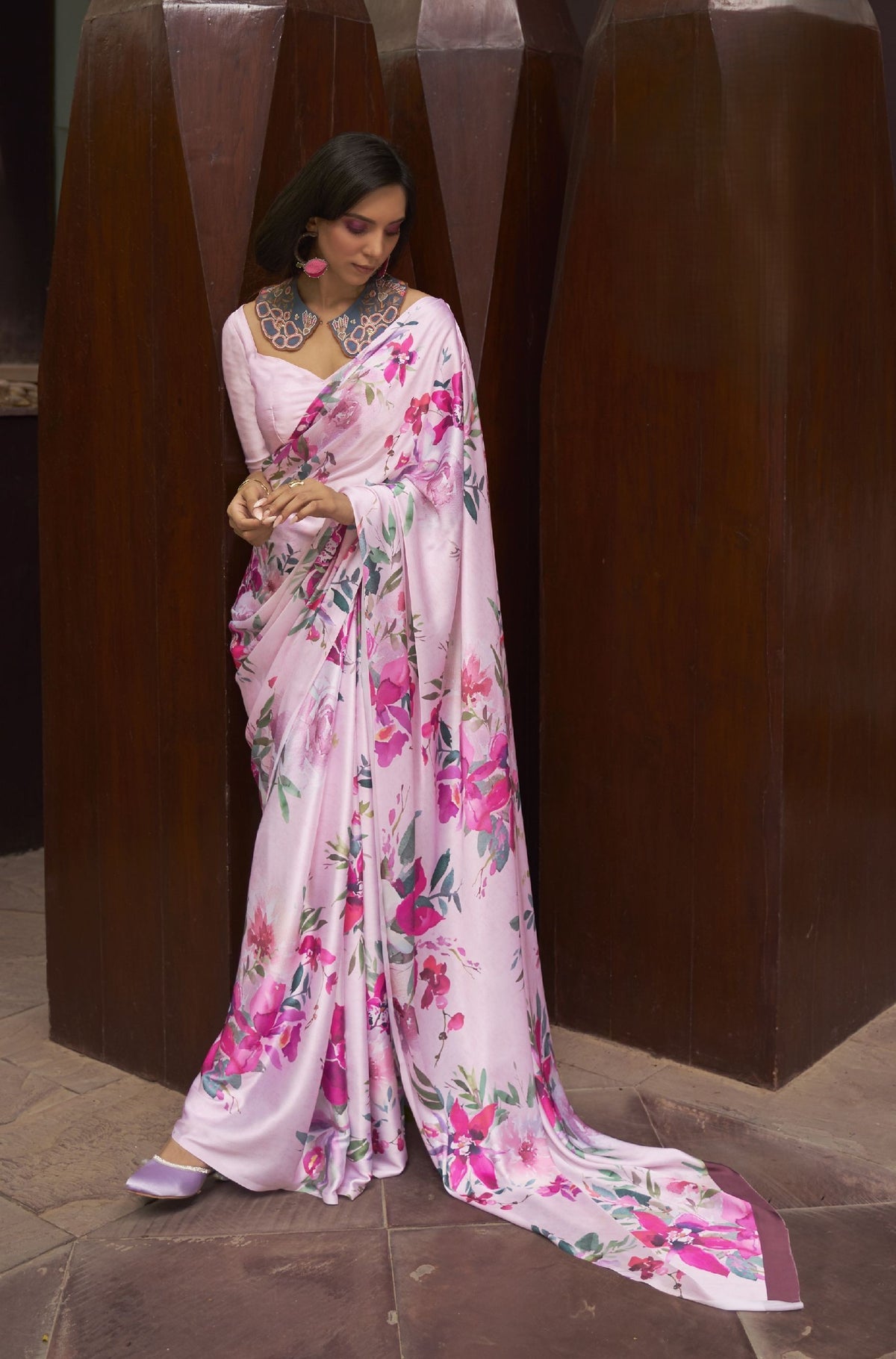 "Light pink silk saree with vibrant floral print—soft shimmer for festive daywear, haldi, and intimate celebrations