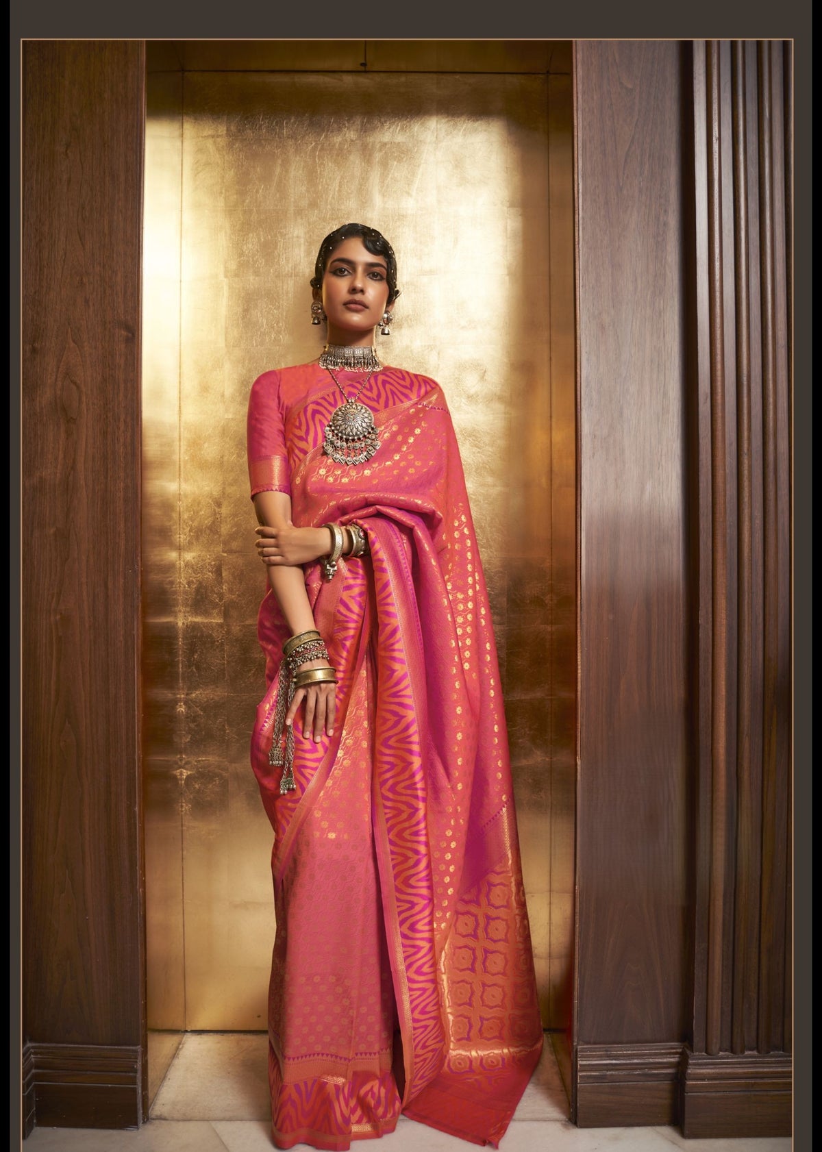 Pink and gold Kazah Silk saree with intricate woven motifs and high‑shine finish, luxurious festive saree for weddings and premium celebrations