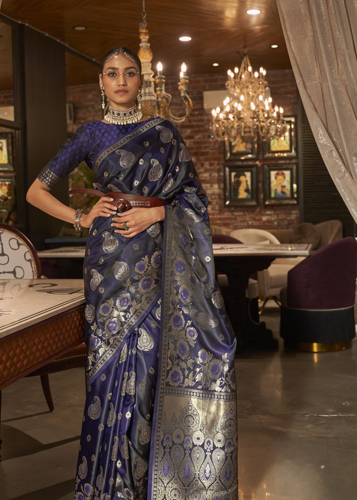 Navy blue silk saree with gold and silver woven motifs and a coordinated blouse