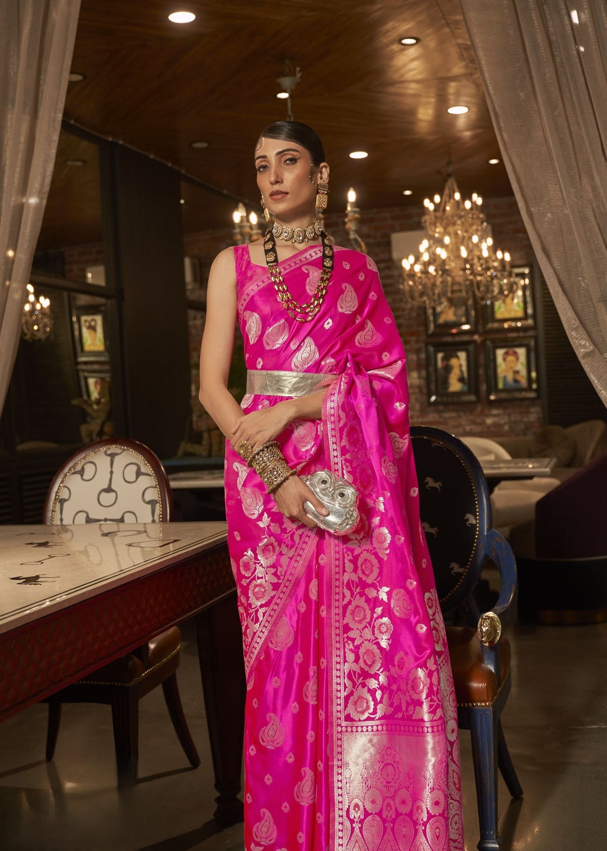 Bright pink silk saree with silver woven floral and paisley patterns