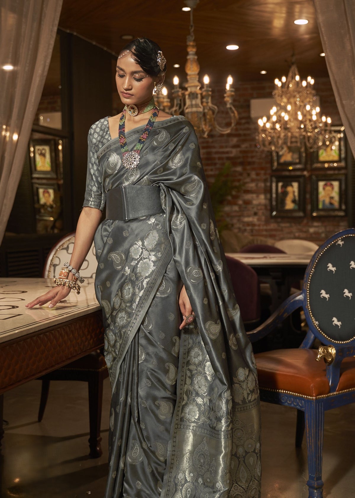 Metallic grey silk saree with silver floral and paisley weaving.