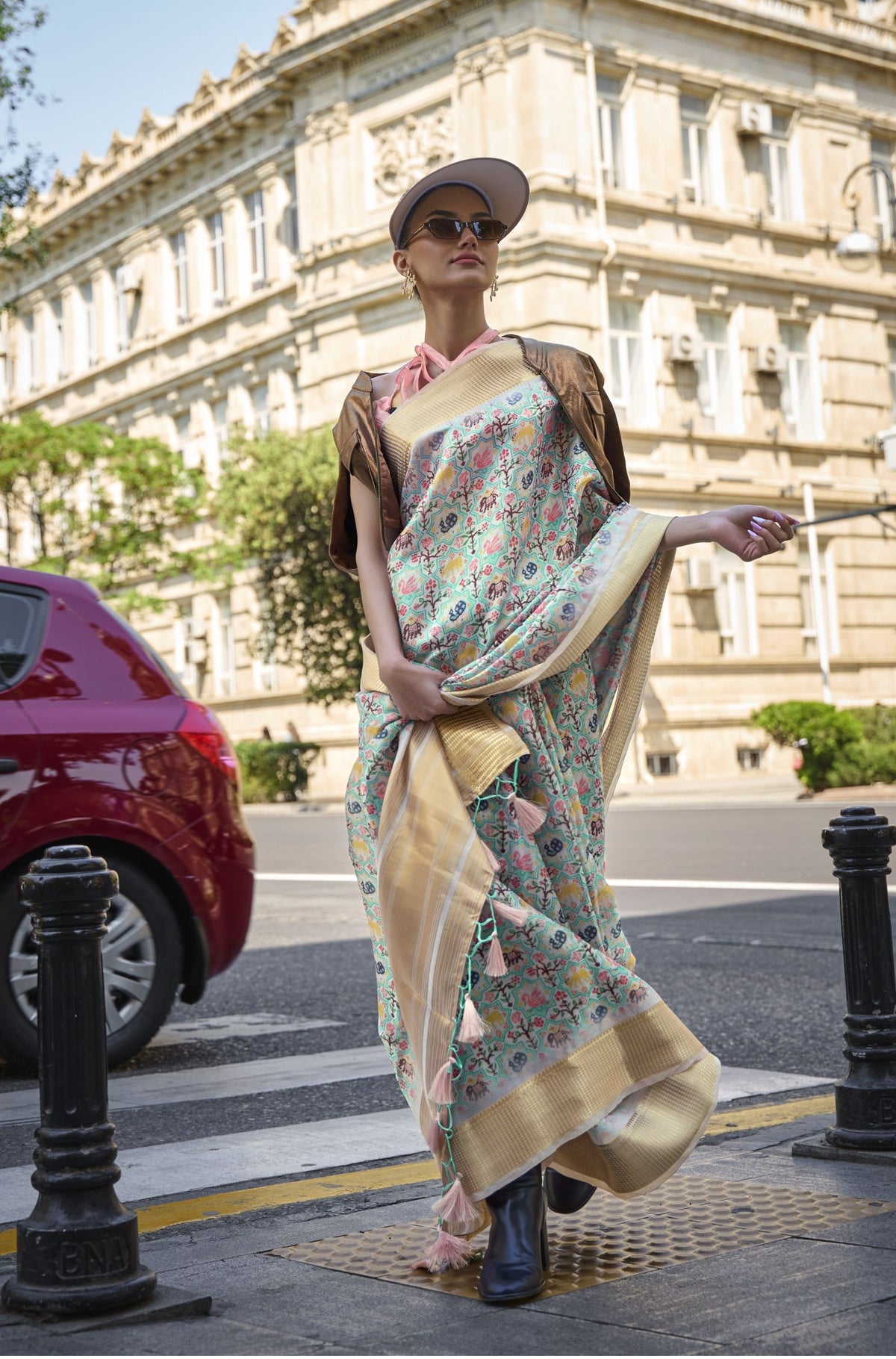 Floral satin organza saree with golden border—sporty-luxe styling with soft shimmer and urban flair