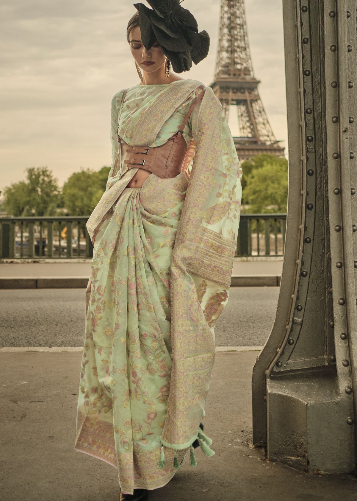 Pastel green Kashmiri organza handloom saree with fine handloom detailing for weddings, festive events, and Bollywood‑style celebrations