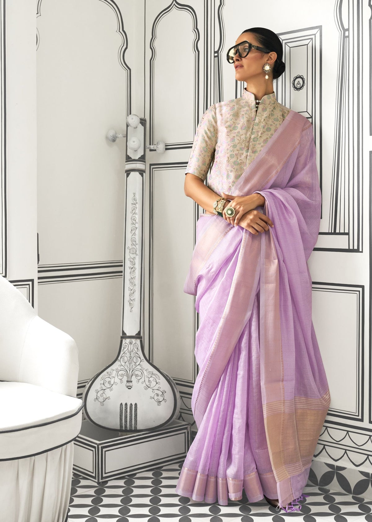 Lavender moss chiffon handloom saree with gold border, paired with a high‑neck floral embroidered blouse