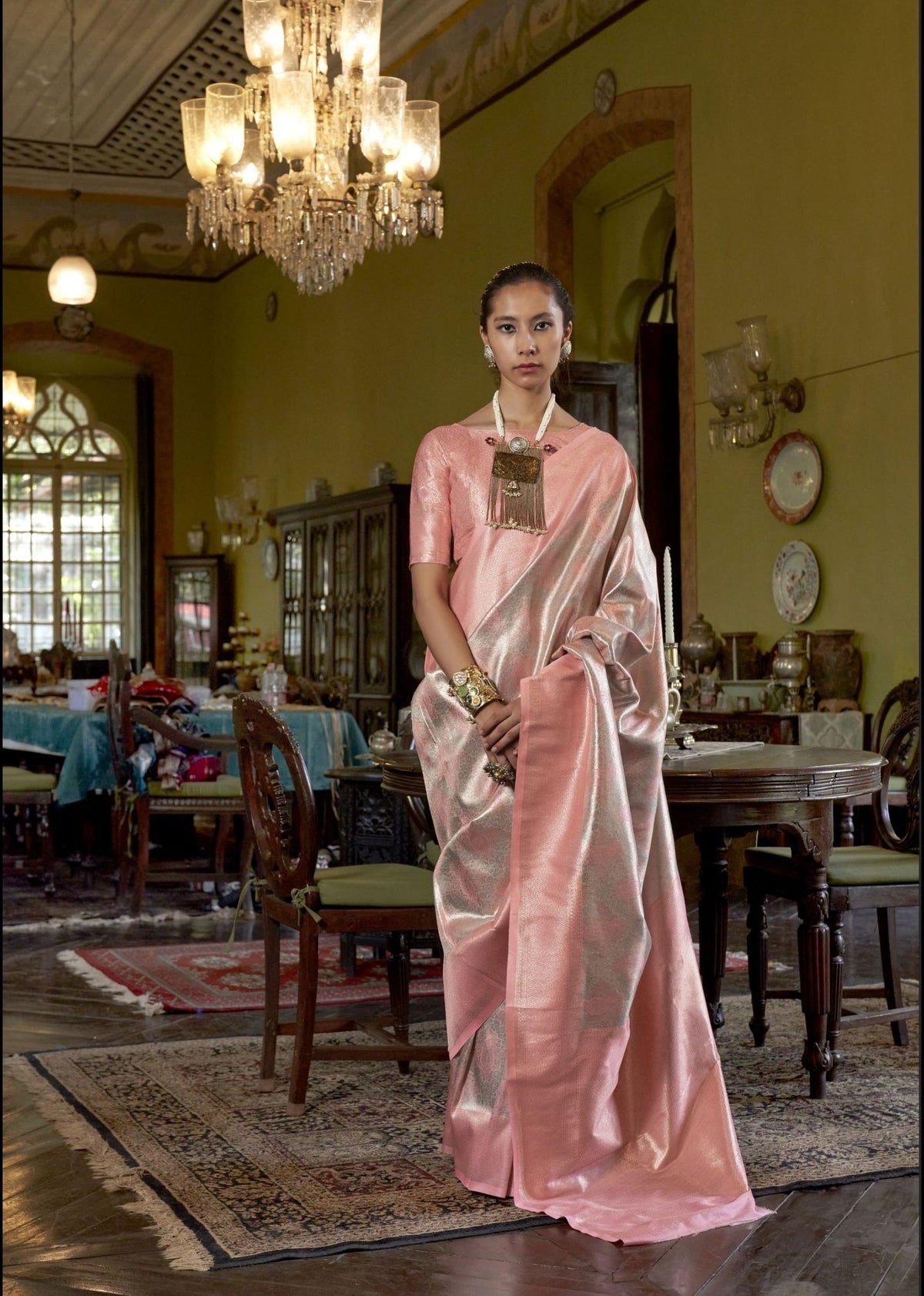 Peach, pink and silver Kanjivaram silk saree with shimmering zari work and a contemporary designer pallu.