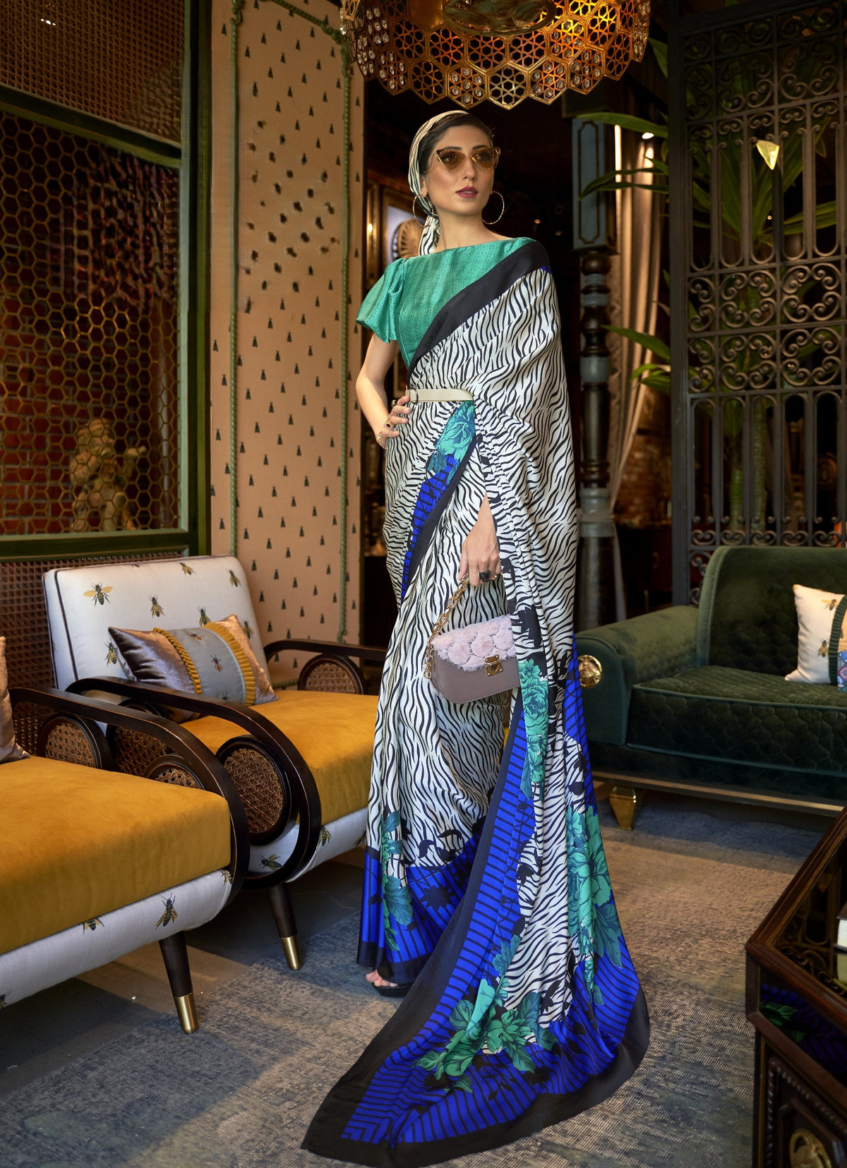 White and black zebra print saree with turquoise and blue floral border