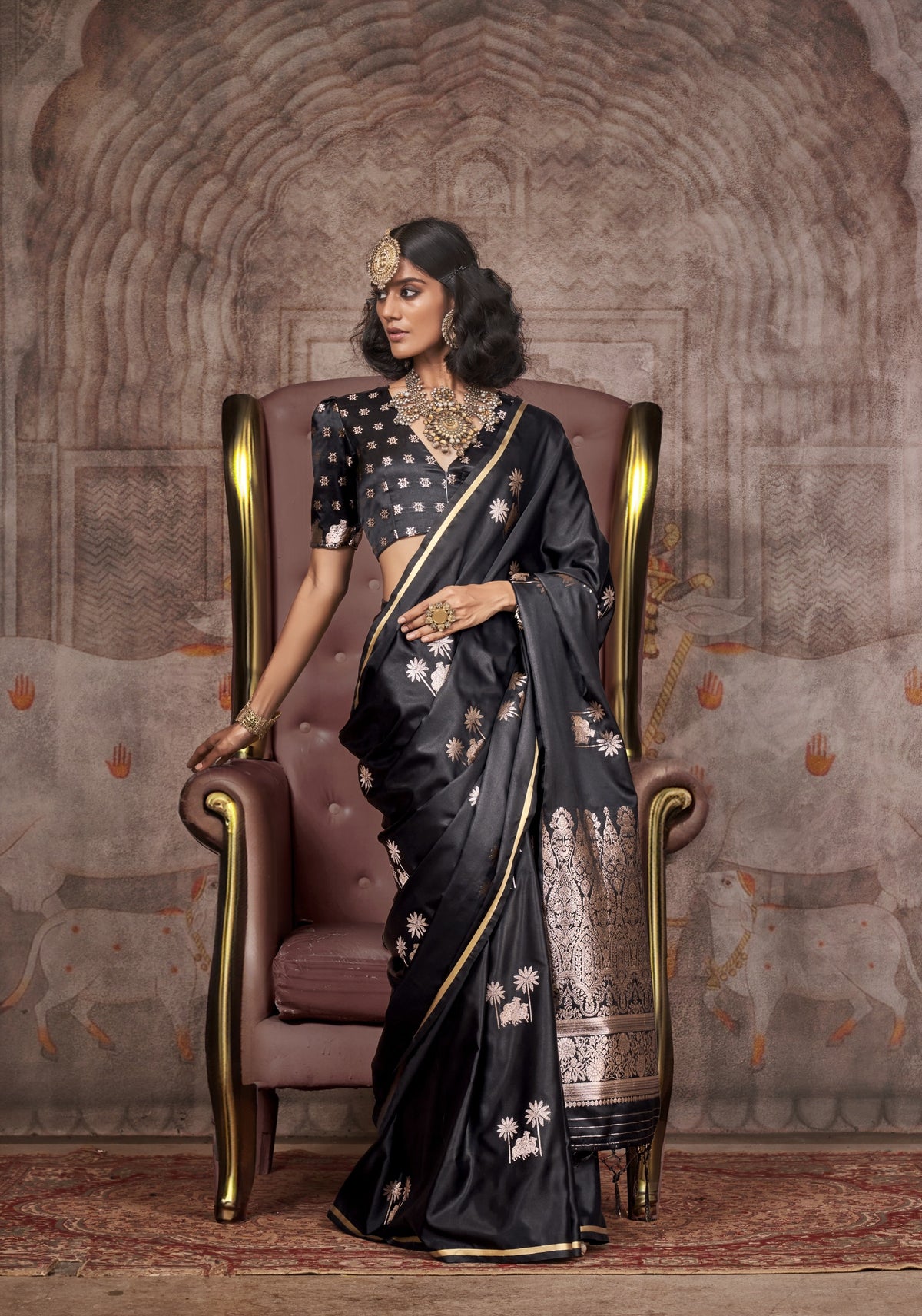 Black silk saree with silver zari floral motifs and gold border - designer Banarasi saree
