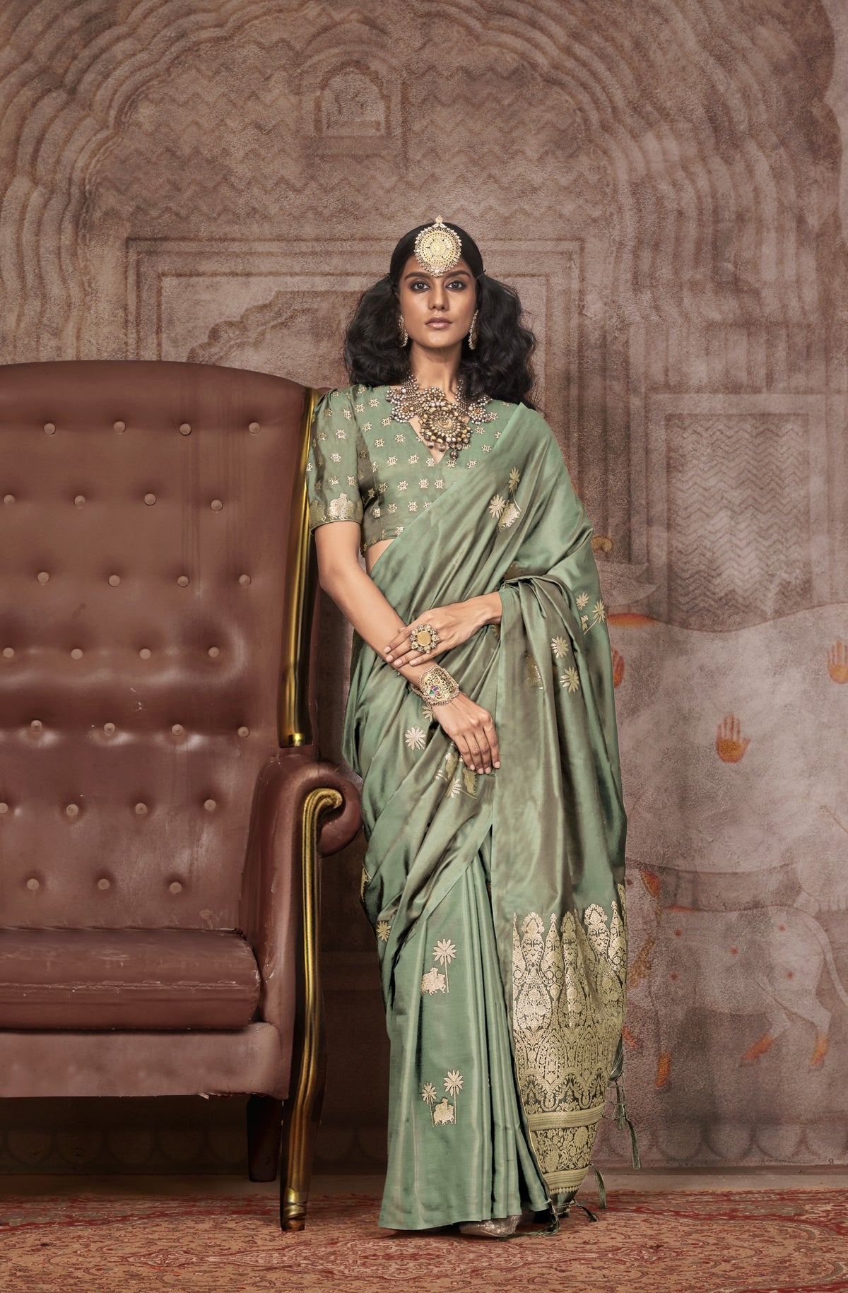 Sage green silk saree with gold zari floral motifs and Banarasi border - traditional saree