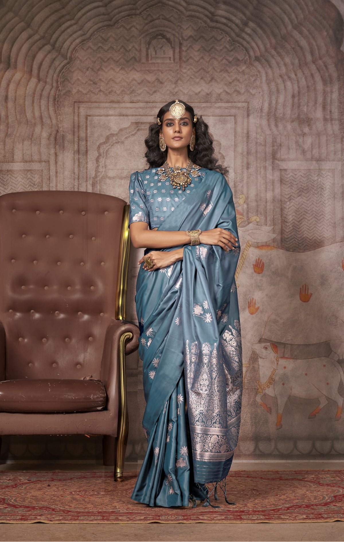 Teal blue silk saree with silver zari floral motifs and Banarasi border - designer saree