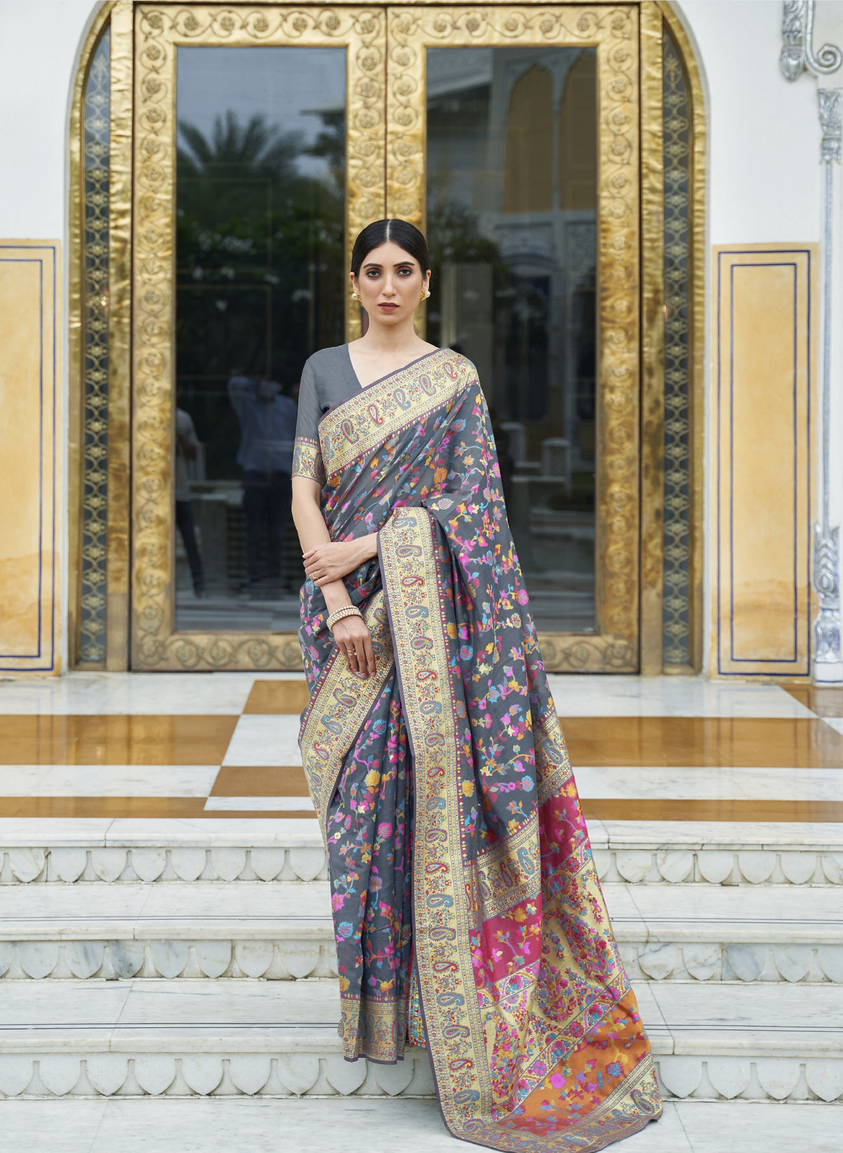 Charcoal grey silk saree with multicolor floral embroidery and gold zari border