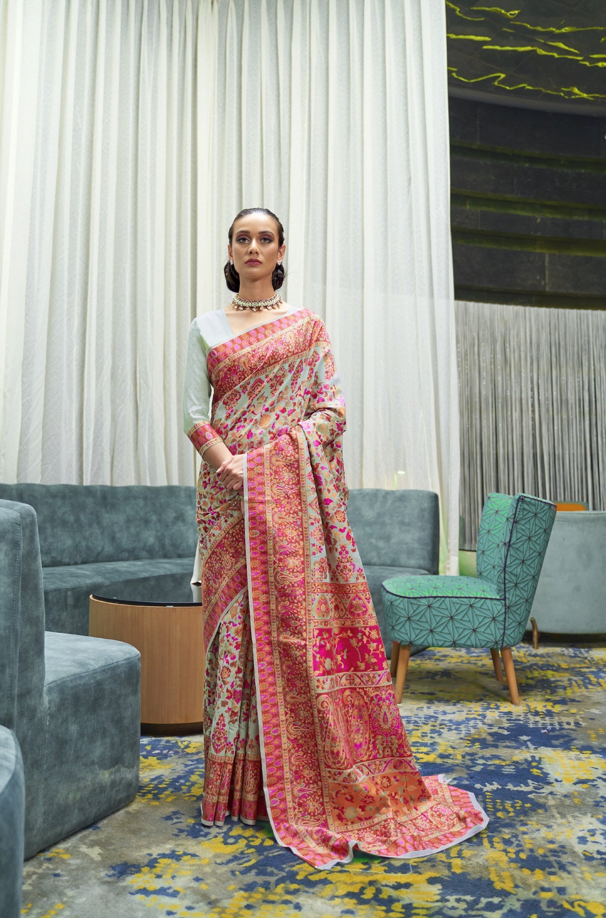 Cream ivory silk saree with pink and multicolour Kashmiri embroidery and gold border